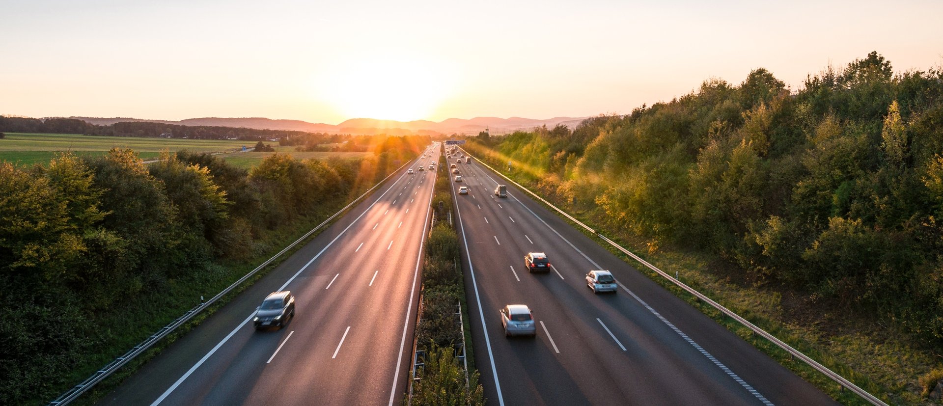 The road traffic on a motorway at sunset
